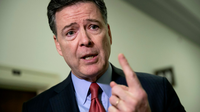 FILE - In this Dec. 17, 2018 file photo, former FBI Director James Comey speaks to reporters on Capitol Hill Washington. Comey will testify before the Senate Judiciary Committee on Sept. 30, appearing just a month before the presidential election as Republicans have tried to make the case that he and his agency conspired against Donald Trump in 2016.   (AP Photo/J. Scott Applewhite)