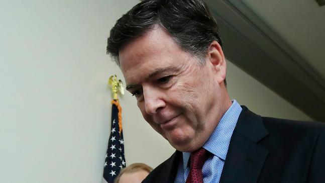 Former FBI Director James Comey speaks to reporters after testifying under subpoena behind closed doors before the House Judiciary and Oversight Committee on Capitol Hill in Washington, Friday, Dec. 7, 2018. (AP Photo/Manuel Balce Ceneta)