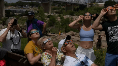 Image for story: Clouds break just in time for many in Texas to view eclipse